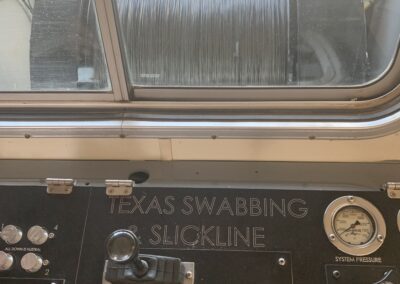 A close-up view of a train's control panel, featuring various buttons, switches, and displays for operation.