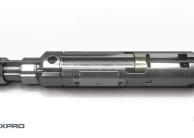 An expro piston positioned within a metallic cylinder, showcasing its engineering design and functionality.